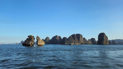 Close up of the Kissing Rocks in Ha Long bay, Vietnam in sunset, known as Rock of the Kissing Cocks.
