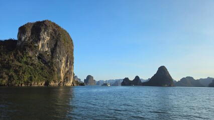 Amazing limestone rocks island in Ha Long bay, Vietnam in sunset.