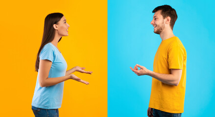 Communication. Profile portrait of casual woman and bearded smiling caucasian man talking isolated over halved blue and yellow studio background. Side view of positive couple discussing © Prostock-studio