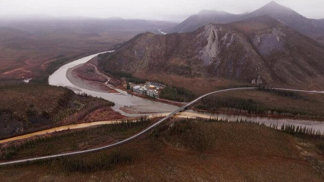 Aerial View Of River Road Bridge On The Dempster Highway With Ogilvie Mountains In Yukon Canada.