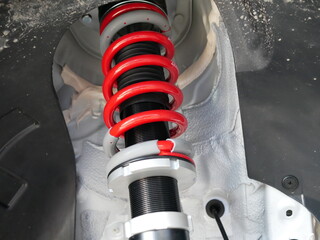 red shock absorbers of car at garage.	
