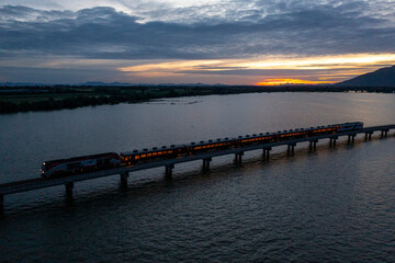 Floating train on Pa Sak Cholasit Dam is the unseen trip in twilght time at Lopburi : Thailand