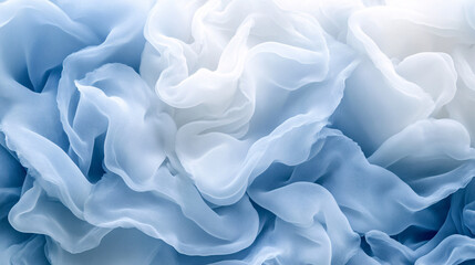 Obraz premium A delicate swirl of soft blue and white fabric, creating an elegant, textured appearance reminiscent of gentle waves or floral petals.