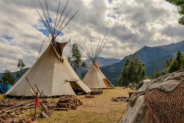 Community of people in a camp in the mountains of cusco peru on a vision quest with teepees 