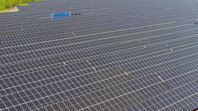 Aerial pan highlighting rows of bifacial panels at Solar Farm in Europe