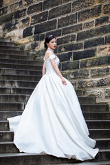 A sensual bride in white wedding dress at a dream wedding. The bride looked beautiful on wedding day. A beauty asian bride, perfect wedding. Elegance young bride. The brides beauty.