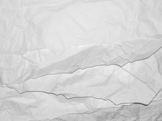 White paper is rough and torn wiht zigzag and overlapping patter