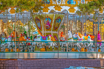 An empty park carousel on a winter day