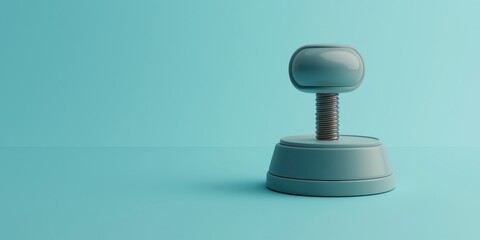 A minimalist teal background showcases a simplistic, modern gray stamp, emphasizing sleek design and functionality.