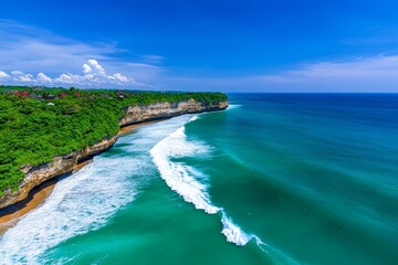 Obraz premium A stunning seaside cliff view with deep blue ocean waves crashing below and a vibrant sky above