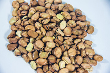 Uncooked beans, vegetarian food, isolated on white background, organic culinary grains, agriculture composition concept, hard peel, selective focus, shallow depth of field, Cairo Egypt