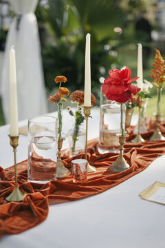 Elegant Wedding Table Decor with Velvet Runner and Floral Centerpieces