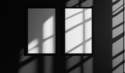 Two black framed white pictures are on a wall