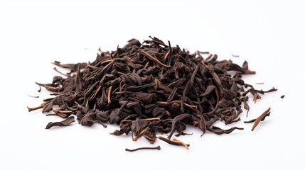 Obraz premium Dried black loose tea leaves in a heap on a clean white background showcasing their rich color and texture for culinary and beverage use