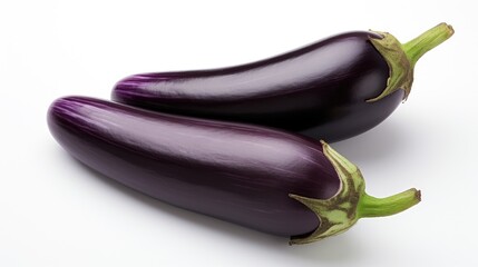 Fresh organic eggplants arranged on a clean white background showcasing their vibrant purple color and natural shine.