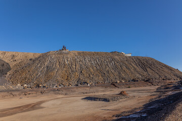 A huge mine dump from an abandoned lead and silver mine with a memorial to deceased miners on top...