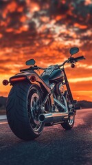 Fototapeta premium Motorcycle parked on road during sunset