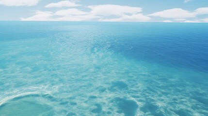 Obraz premium Aerial view of serene ocean waters with soft waves and a clear distant horizon under a bright sky