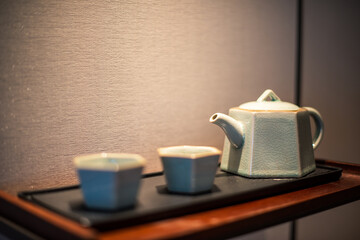 teapot and cups on a table