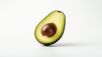 Ripe avocado half showcasing vibrant green flesh and brown seed isolated on clean white background for culinary and health concepts