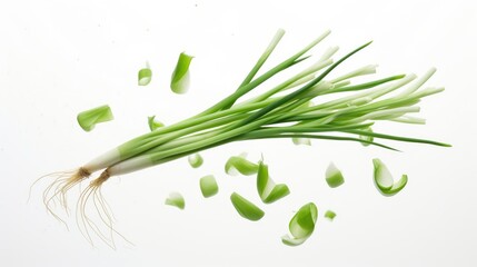 Falling fresh green onions with chopped segments on a clean white background highlighting culinary freshness and vibrant colors