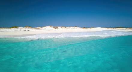 Fototapeta premium Turquoise Ocean Waves Crashing on Pristine White Sandy Beach