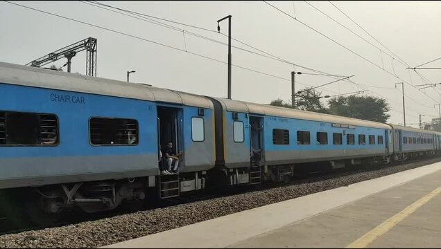 Delhi, India, November 02 2024 - Indian railway express train at departure from Anand Vihar railway station during morning time, Colourful Express train at Delhi railway station