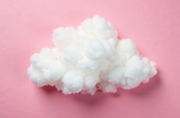 Fototapeta premium Cloud of cotton wool on a pink background. Concept of rain, rain. Flat lay, top view
