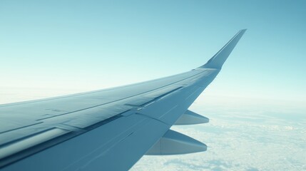 Obraz premium Airplane wing above clouds.