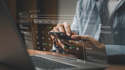 Business Planning Calendar and Project management concept. Businessman manages time for effective work. Calendar on the virtual screen interface. Time management. Reminder appointment.
