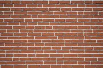 a close up of a red brick wall with a fire hydrant