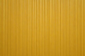 yellow wall with vertical lines and a single red stop sign