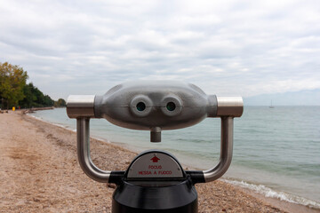 Coin Binoculars at Peschiera del Garda beach