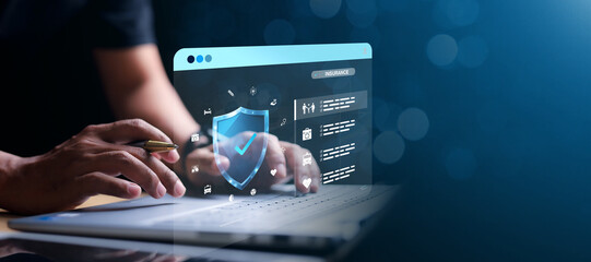 Insurance concept. Businessman using a computer to insurance online for family and life, financial,...
