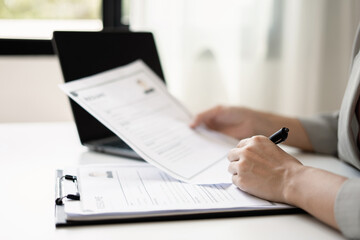 Business woman employer holding resume hiring recruit looking cv resume to hire candidates, analyzing information before job interview. Recruitment concepts