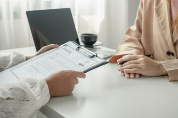 Fototapeta premium Business people hold a resume and talk to job applicants for job interviews about careers and Their personal history in the company. Recruitment concepts