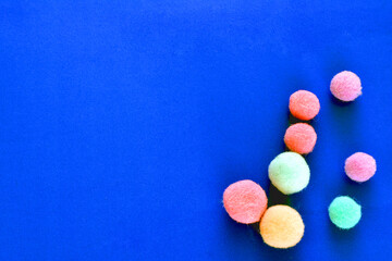 Greeting card with Christmas tree balls on a blue background.