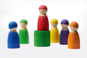 Wood, figure and symbol on white background for leadership, diversity or teamwork with social group. Wooden icon, studio and friendship with connection, society or abstract people together with color