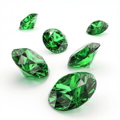 Fototapeta premium Six round cut emerald gemstones sparkling on a white background