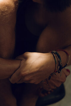 Colored traditional Thai bracelets on men's wrists
