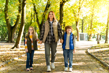 Obraz premium Children walking outdoors in social gathering in park enjoying free time together with fun