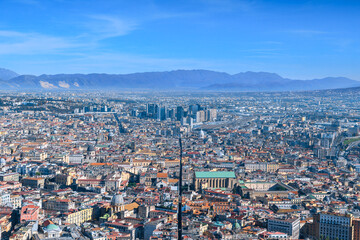 Obraz premium View of Spaccanapoli street splitting city center of Naples. Napoli city skyline with historical Old town, Spaccanapoli street and modern financial district skyscrapers, Italy.