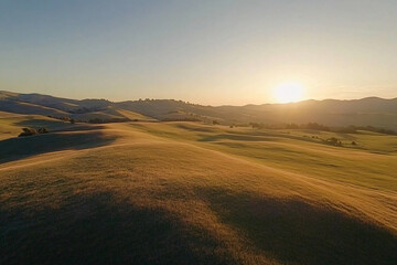 golden sunset over rolling hills in rural landscape