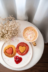 Homemade pancakes with strawberry sauce, cappuccino, woman day morning concept, Valentine's day, February