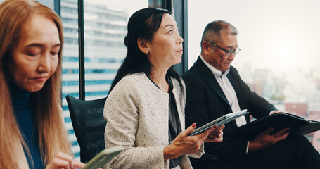 Obraz premium Japan, meeting and business people in office on tablet for planning, discussion and website research. Corporate, company and men and women on digital tech for negotiation, teamwork and collaboration