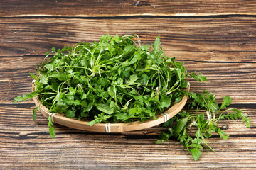 fresh shepherd's purse vegetable on wooden table.