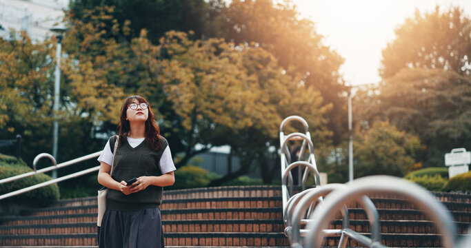 Walking, steps and woman in city for travel with international exchange student program. Stairs, education and young female person on commuting journey in town for university or college in Japan.