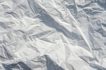 Obraz premium High-resolution image of a crumpled white paper texture, ideal for background designs and various creative applications.