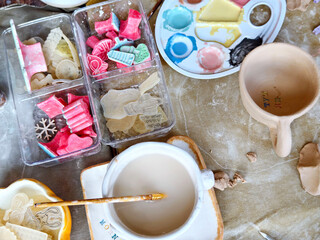 Workshop for kids. Children learning how to use clay for making beautiful dishes. Workshop, master class.