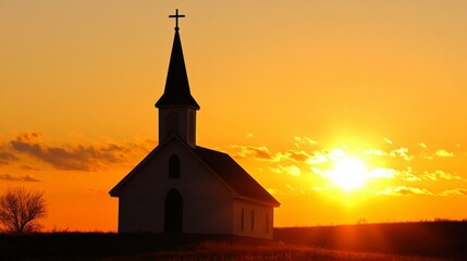 Fototapeta premium Serene Silhouette of a Church Against a Vibrant Sunset Sky with Warm Orange and Yellow Tones Illuminating the Peaceful Landscape in Rural Setting
